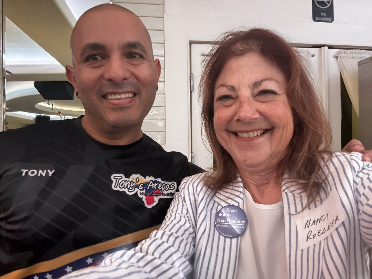 Nancy Roecker with a local business owner